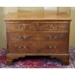 A George III oak chest, fitted two short & two long graduated drawers with brass swan-neck