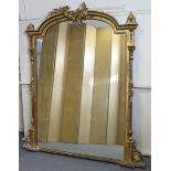 AN EARLY VICTORIAN GILTWOOD & EBONISED OVERMANTEL MIRROR, the shaped architectural cornice with