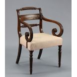 A Wm IV mahogany open armchair with brass-inlaid figured panel to the rope-twist back, reeded scroll
