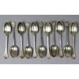 Eleven George V silver rat-tail trefid coffee spoons with engraved family crest to the terminals;