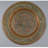 A 20th century copper circular wall plaque with pierced & embossed floral decoration, 22¾”.