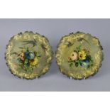 A pair of Victorian papier-mache circular panels with polychrome & gilt decoration of flowers &