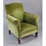 An Edwardian square-back armchair upholstered green velour, & on short square tapered legs.