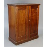 An early 20th century mahogany dwarf cupboard fitted three shelves enclosed by a pair of panel