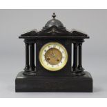 A late 19th/early 20th century mantel clock with two-part dial & in black slate architectural