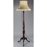 A mahogany Chippendale-style standard lamp with turned & fluted column on three carved cabriole