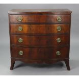 A Georgian mahogany bow-front chest fitted four long graduated drawers with brass swing handles, &