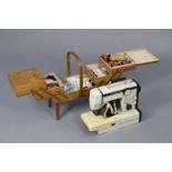 An “Atlantis 2” electric sewing machine; & a cantilever needlework box, with contents.