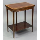 An Edwardian mahogany crossbanded small card table with a rectangular fold-over top, fitted with a