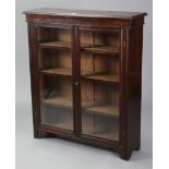 A mahogany dwarf cabinet with two adjustable shelves enclosed by a pair of glazed doors, 36” wide