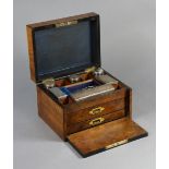 A 19th century mother-of-pearl inlaid walnut jewellery box with a fitted interior enclosed by a