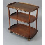 An elm rectangular three-tier tea trolley on round tapered legs with Shepherd’s castors, 28” wide