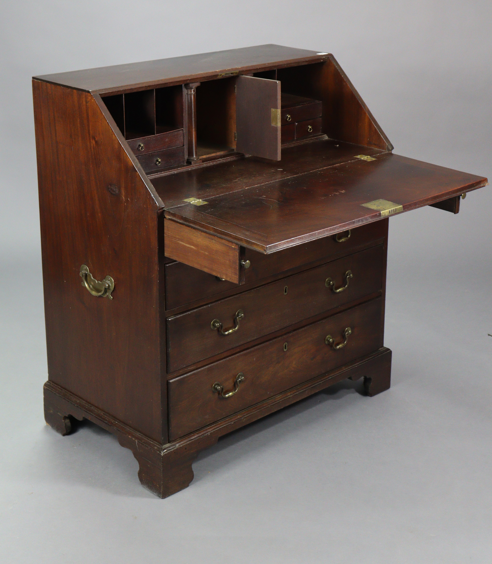 A Georgian mahogany bureau with a fitted interior enclosed by a fall-front above four long graduated - Image 2 of 8