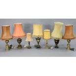 Eight various decorative table lamps including a pair of heavy brass urn-design lamps, each with