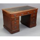 A Victorian mahogany pedestal desk inset tooled leather, & fitted with an arrangement of nine