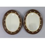 A pair of Victorian small oval wall mirrors in walnut paste-set frames, 15" x 12"; & a gilt frame co
