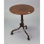 A small mahogany tripod table with a circular top, & on a vase-turned centre column & three cabriole