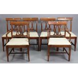 A set of six hardwood splat-back dining chairs (including a pair of carvers) with padded seats &