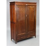 A Chinese-style hardwood cupboard fitted two shelves enclosed by a pair of panel doors above two