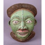 A BAMILEKE (CAMEROON) BEADED FACE MASK, of green ground with braided crest, protruding nose &