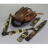 A tan leather horse-riding saddle; & various horse brasses.