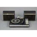A Vintage Philips “604” portable turntable, with speakers.