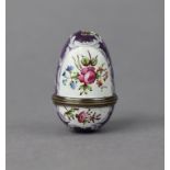 An 18th century BILSTON FLORAL ENAMELLED EGG-SHAPED NUTMEG GRATER, 1¾” high (w.a.f.).