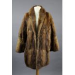 A rabbit fur silk-lined ladies’ coat.