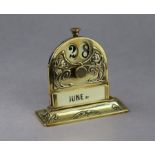 An Art Nouveau brass perpetual calendar with raised stylised floral decoration, 4” high.