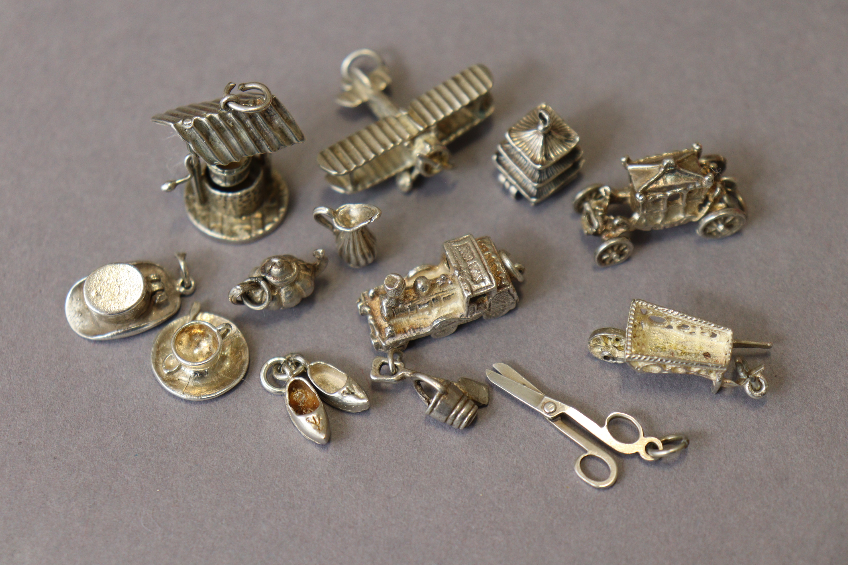 Thirteen various white metal pendant charms (loose), three of which marked “silver”. - Image 3 of 3