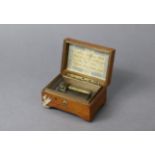 An early 20th century small music box by H.T., with 1¾” long brass cylinder, plays four airs, & in