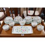 Twenty-six items of Minton’s bone china “Haddon Hall” teaware.