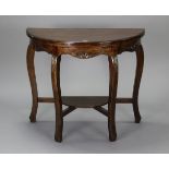 A mahogany demi-lune hall table with a moulded frieze, & on four cabriole legs with an open