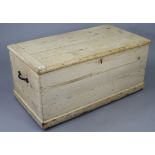A pine blanket box with a hinged lift-lid, & with cast iron side handles, 38½” wide x 17½” high.