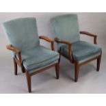 A pair of Parker-Knoll style mahogany frame easy chairs.
