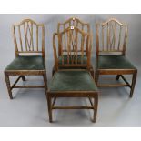 A set of four beech rail-back dining chairs with padded drop-in-seats, & on square tapered legs with