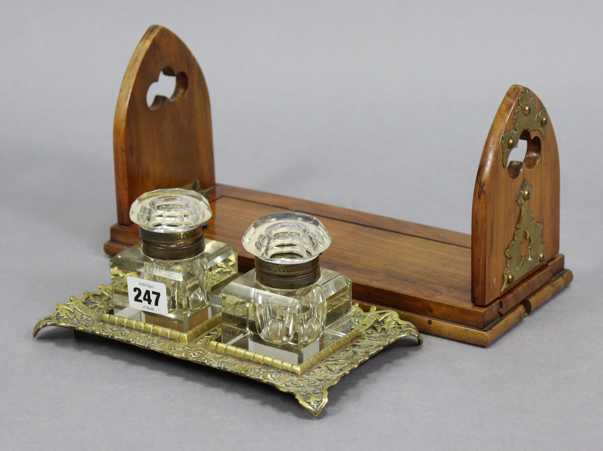 A Victorian brass desk inkstand inset two glass inkwells, 8¾” wide; & a "Betjemen's Patent Self-Clos