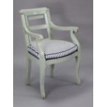 A continental-style pale grey painted wooden barber’s chair with an adjustable back, hard seat, & on