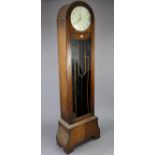 A 1930’s grandfather clock with 12” diameter dial & in an oak case with a domed-top (w.a.f.), 76”