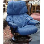A ditto blue leatherette swivel & reclining armchair.