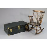 A Spindle-back rocking chair with a hard seat, & on turned supports; together with a travelling