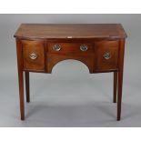 A reproduction inlaid-mahogany bow-front dressing table fitted three frieze drawers, & on square