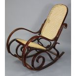 A Bentwood rocking chair inset woven-cane panel to the seat & back.