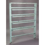 A pale blue painted pine wall-mounted plate-rack, 37” wide x 49½” high; & a pine wall shelf, 64” x
