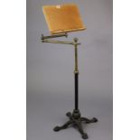 A John Ward of London reading stand on a black painted cast-iron adjustable base with brass