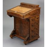 A Victorian inlaid-walnut davenport inset gilt-tooled tan leather to the sloping front, fitted