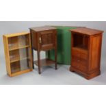 A mahogany bedside cupboard enclosed by a panel door, & on square tapered legs with an open