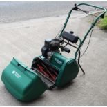 A Suffolk Punch “Cylinder Petrol 175” lawn mower, with grass box.