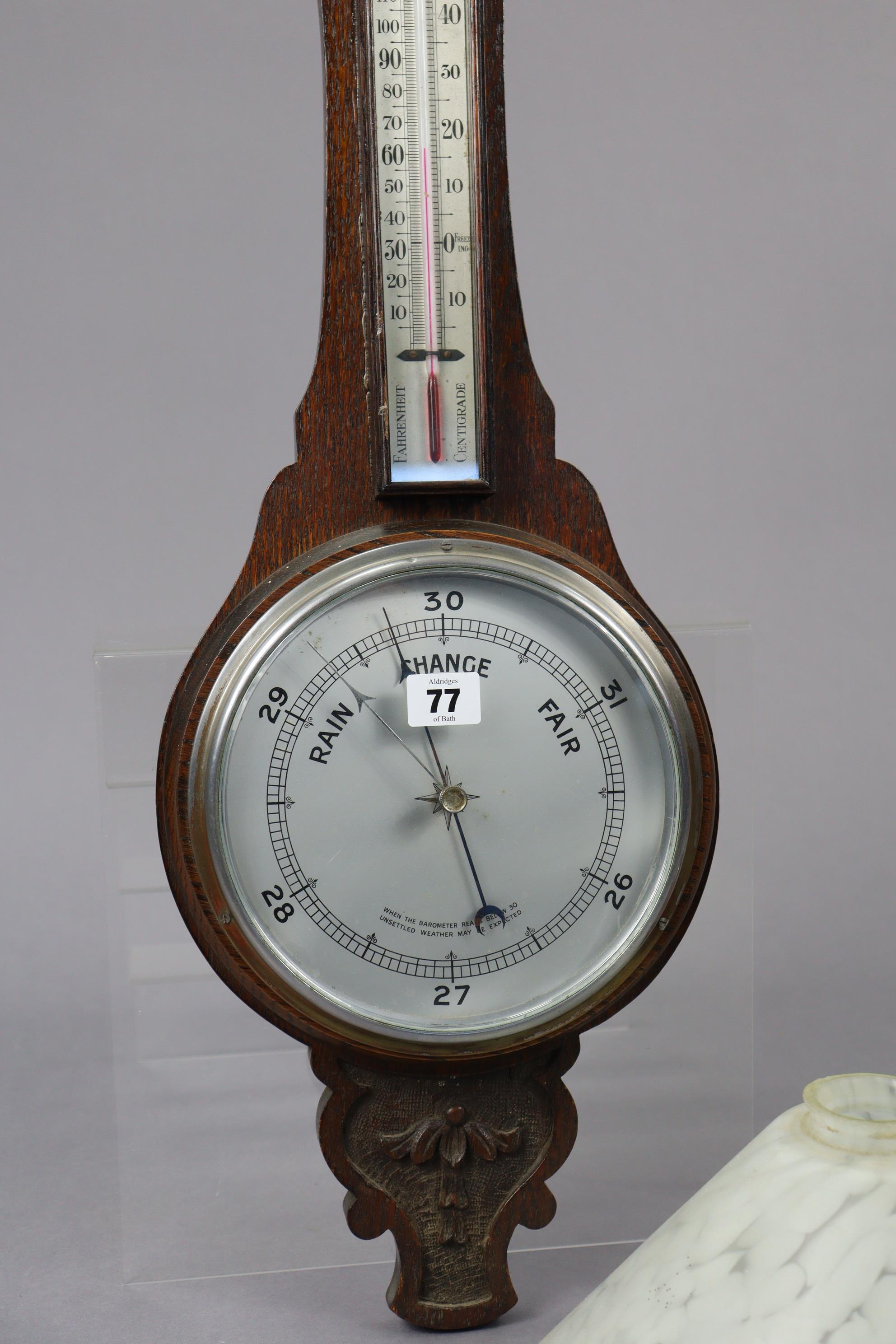 A mid-20th century wall barometer with a 7½” diameter silvered dial, & in a carved oak case, 29” - Image 3 of 4