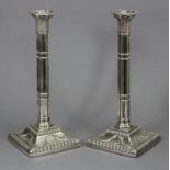 A pair of silver-plated large candlesticks with tapered cluster columns, wheat-ear capitals &